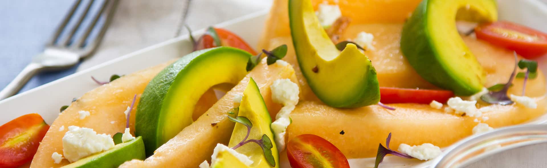 Fresh melon, avocado, and tomato salad